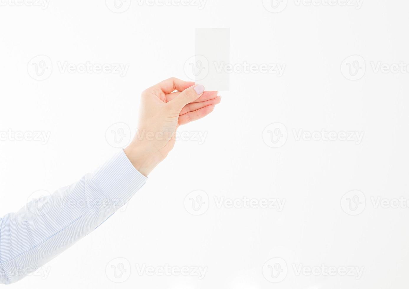 female hand holding business card isolated on white background. Copy space photo