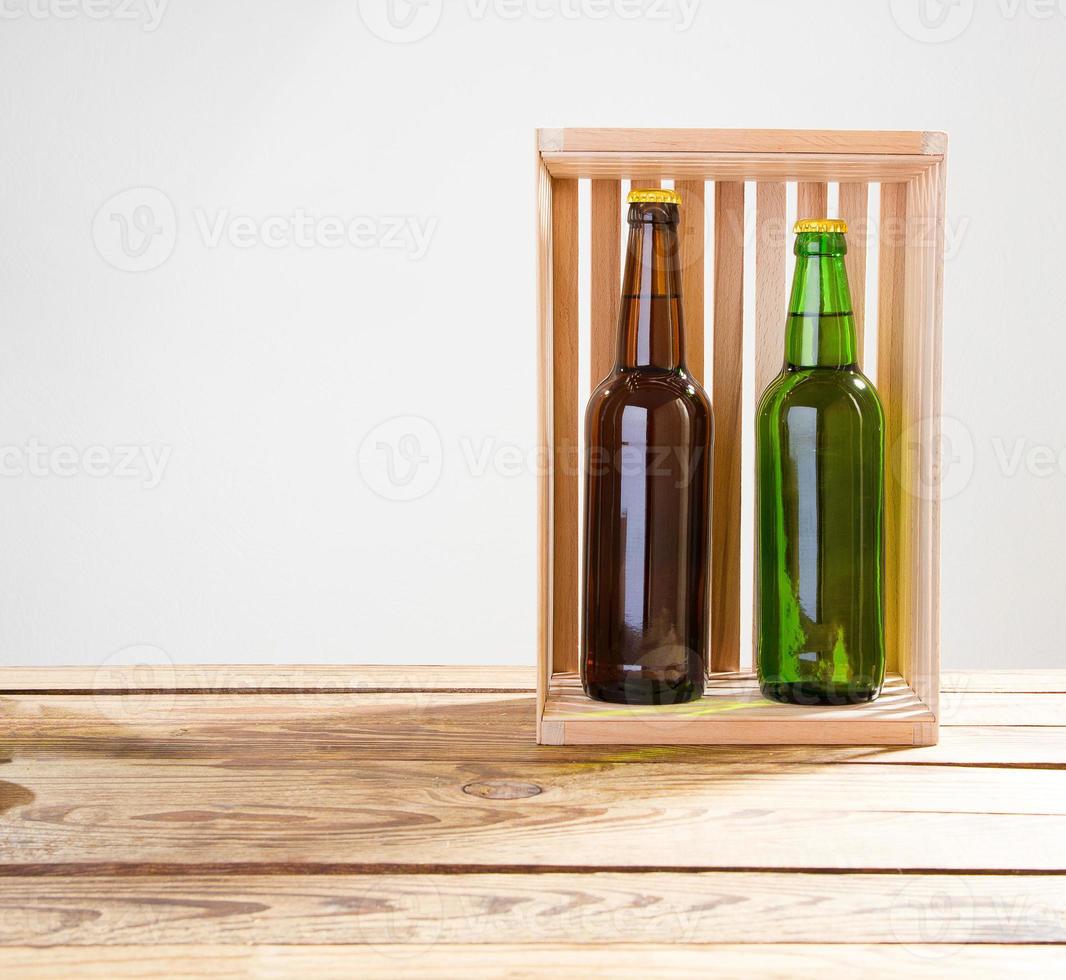 Beer bottles on a wooden table . Top view. Selective focus. Mock up. Copy space.Template. Blank. photo