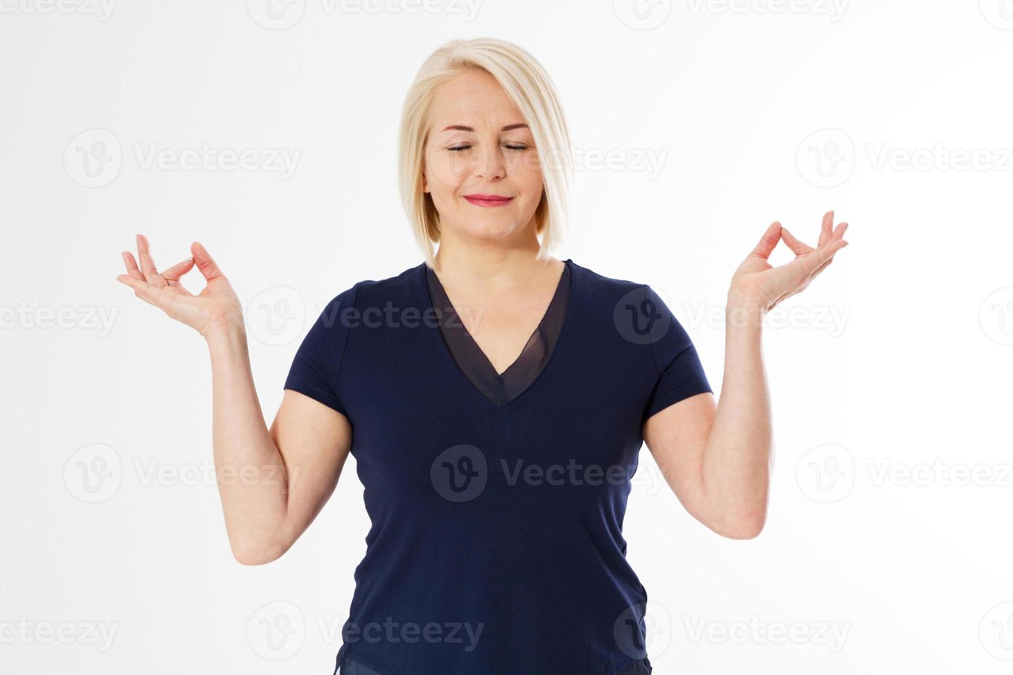 Middle age blonde woman over white isolated background relax and smiling with eyes closed doing meditation gesture with fingers. Yoga concept. Calm pose copy space photo