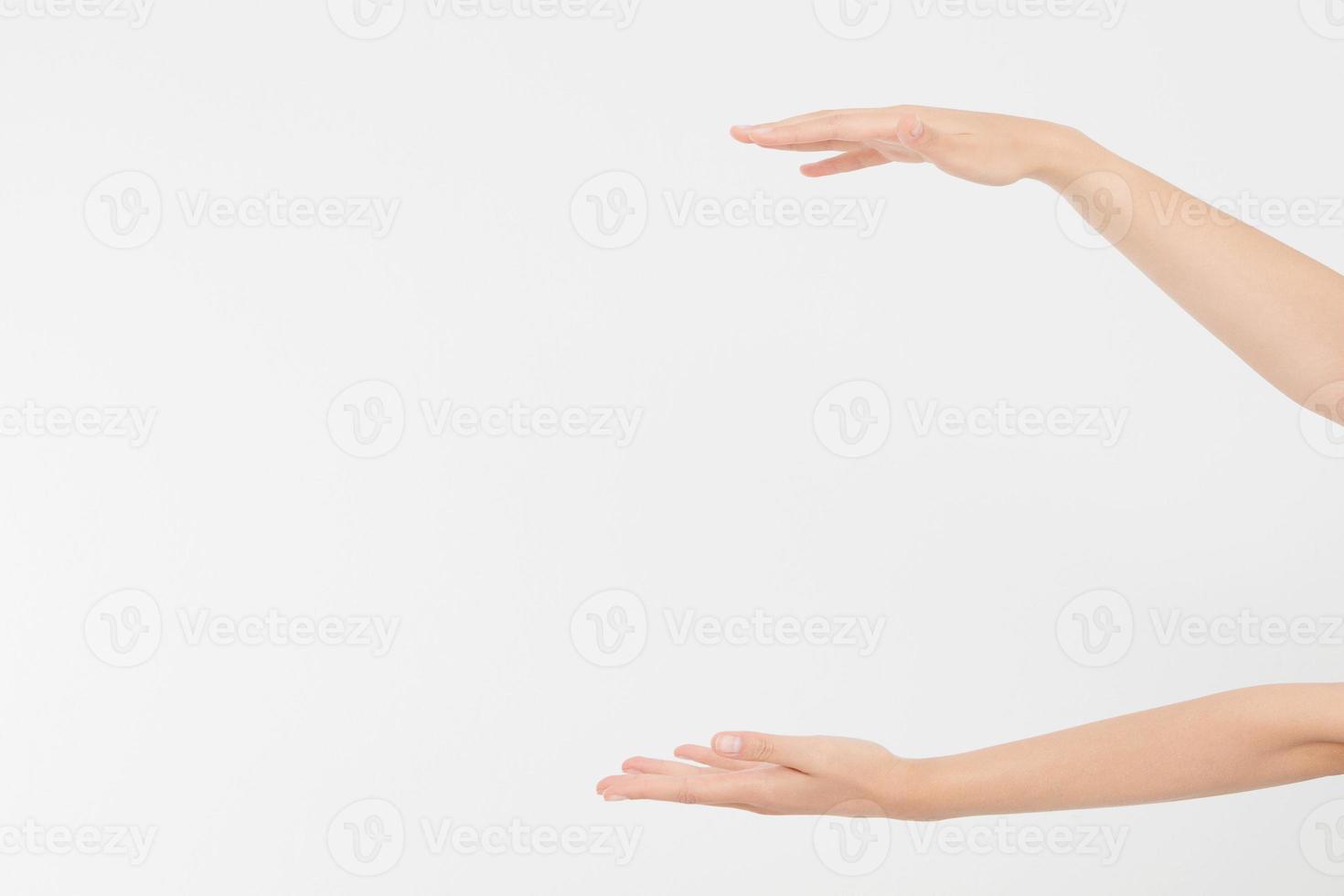 female hands measuring invisible items, woman's palm making gesture while showing small amount of something on white isolated background, side view, close-up, cutout, copy space photo