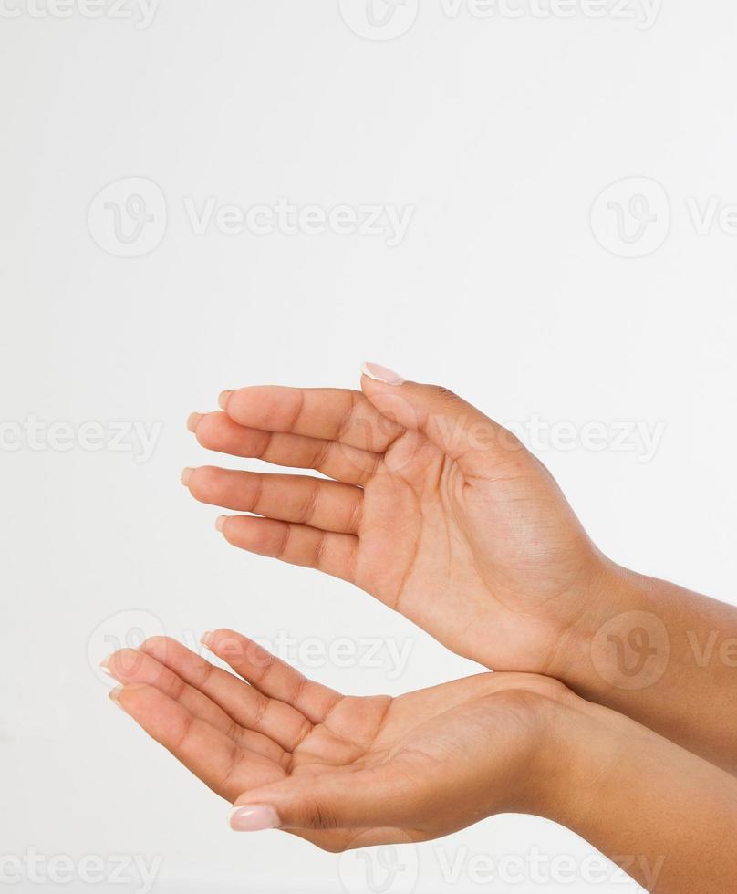 black Woman's hand two palm up. handbreadth isolated on a white background. Front view. Mock up. Copy space. Template. Blank. photo