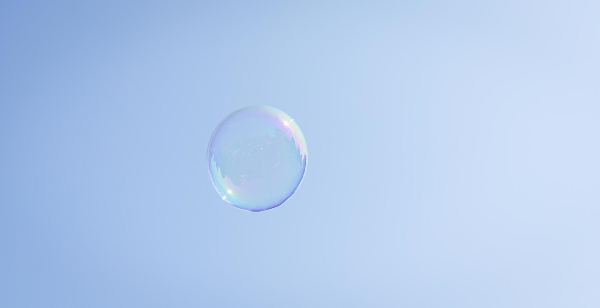 Soap bubble against the sky photo