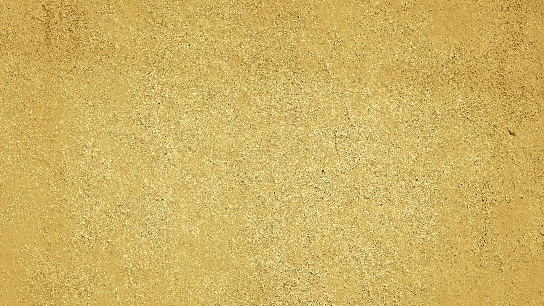 yellow painted abstract concrete wall texture background photo