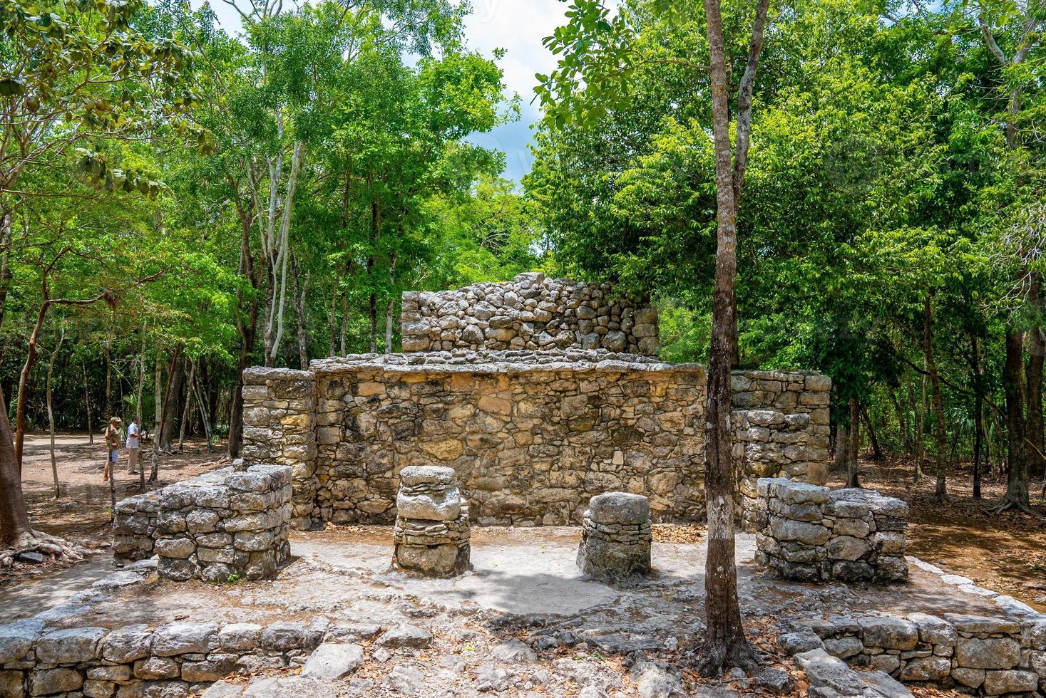 World heritage site and historic ruins of the Mayan city amidst forest photo