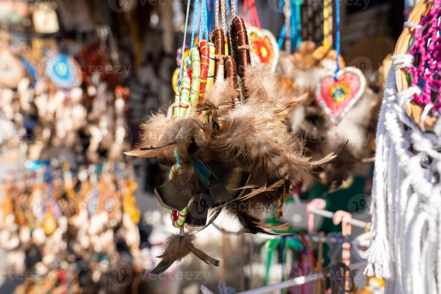 Hanging decorative artifacts for sale in souvenir shop photo