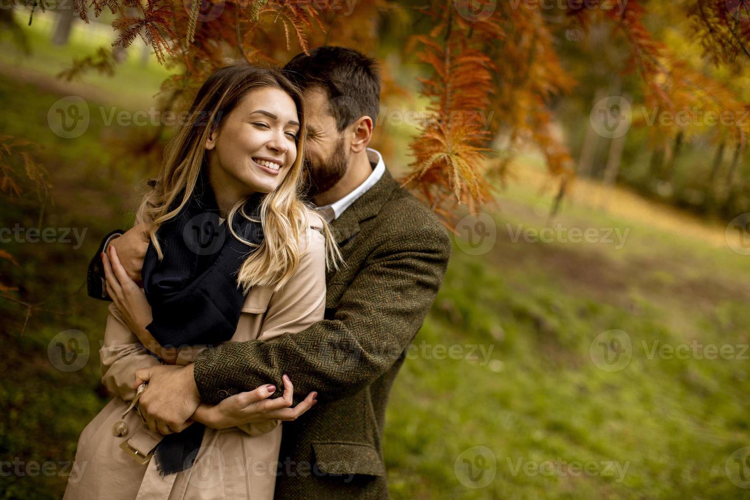 Young couple in the autumn park photo