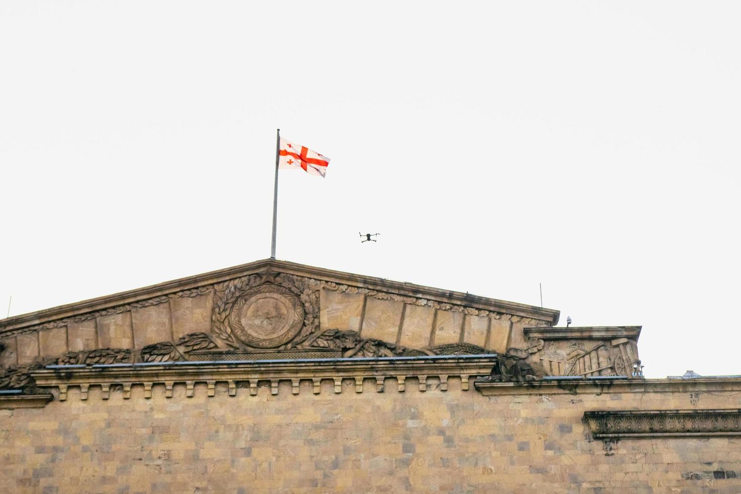 drone in air by building photo