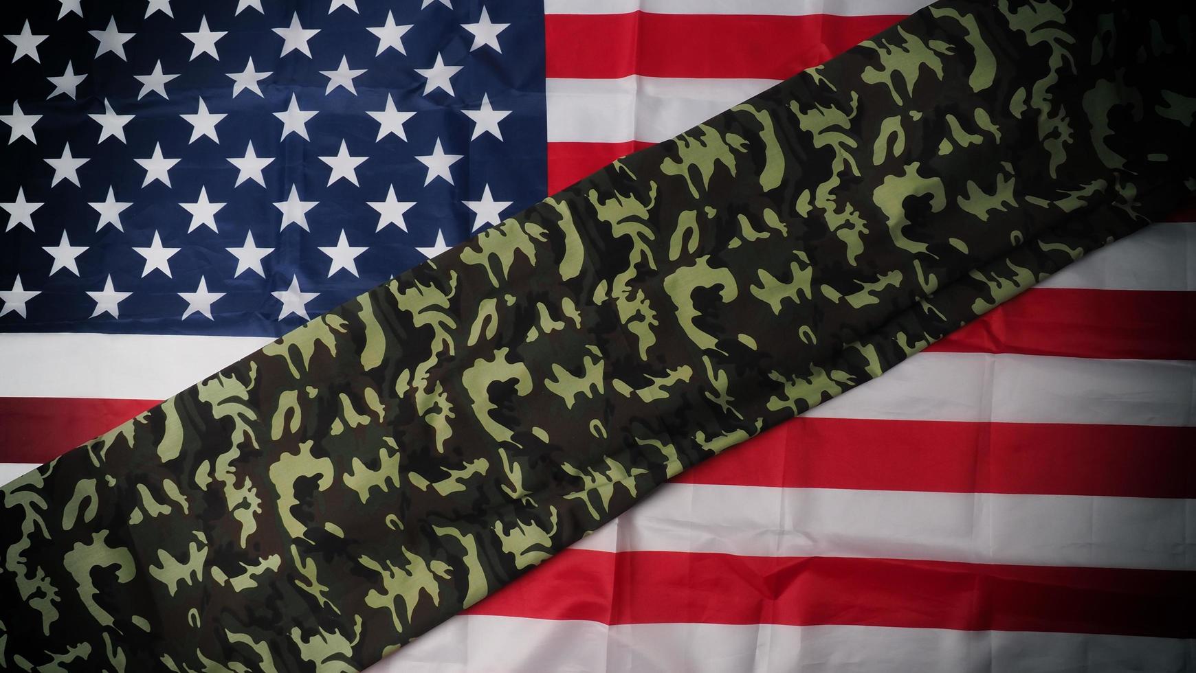 American flag and Military camouflage pattern. Top view angle. photo