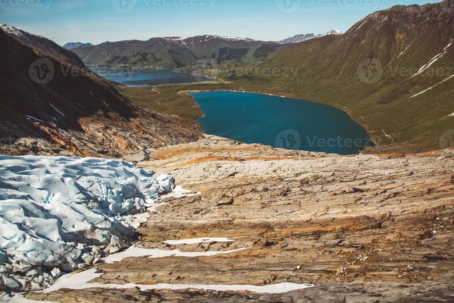 Beautiful scenery on the mountains and the glacier Svartisen landscape in Norway scandinavian nature landmarks ecology concept. Blue snow and ice photo