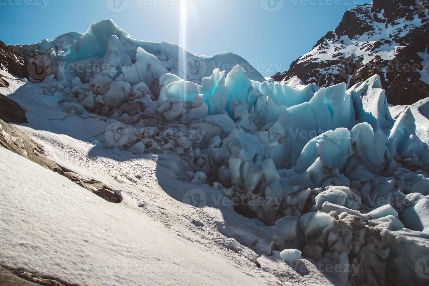 Beautiful scenery on the mountains and the glacier Svartisen landscape in Norway scandinavian nature landmarks ecology concept. Blue snow and ice photo