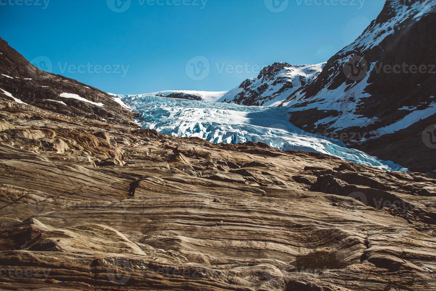 Beautiful scenery on the mountains and the glacier Svartisen landscape in Norway scandinavian nature landmarks ecology concept. Blue snow and ice photo
