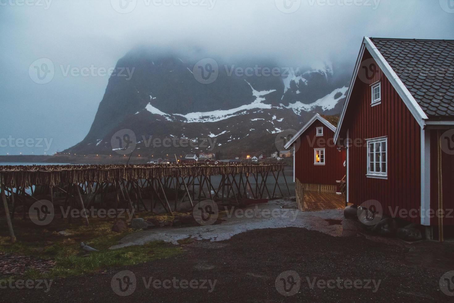 Norway rorbu houses and mountains rocks over fjord landscape scandinavian travel view Lofoten islands. Natural scandinavian landscape. photo