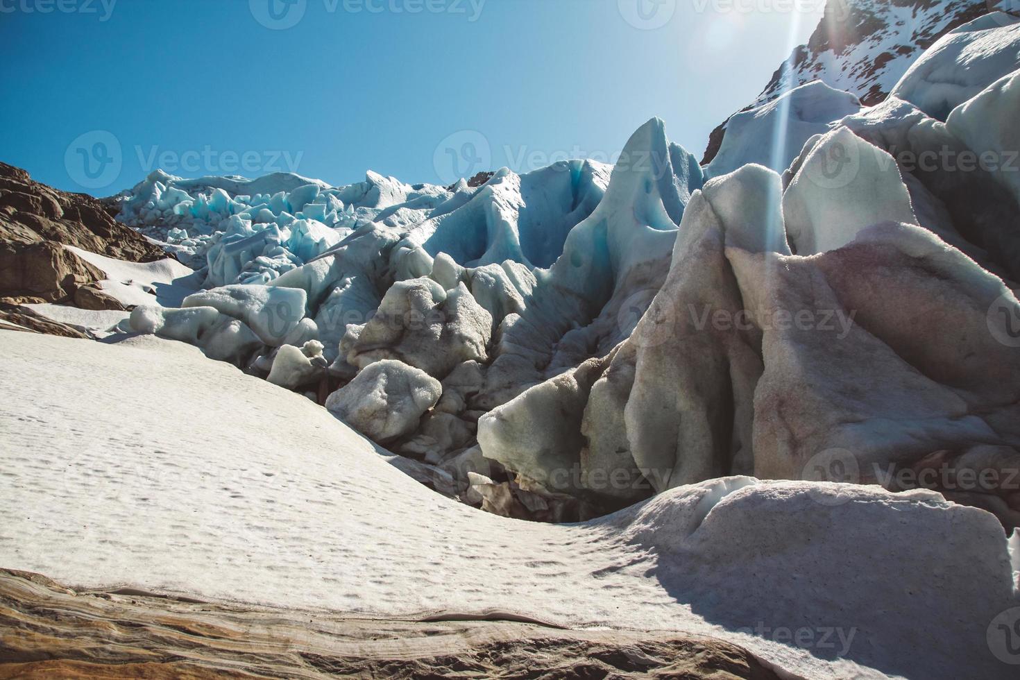 Beautiful scenery on the mountains and the glacier Svartisen landscape in Norway scandinavian nature landmarks ecology concept. Blue snow and ice photo