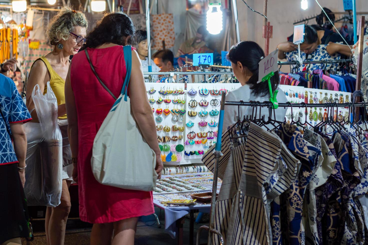 Chiang Mai Walking Street CHIANG MAI THAILAND12 JANUARY 2020A local handicraft market made from silkceramicsmetalglasswood or art and food Thai tourists and foreigners enjoy walking and shopping photo