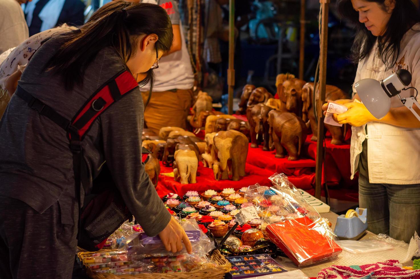 Chiang Mai Walking Street CHIANG MAI THAILAND12 JANUARY 2020A local handicraft market made from silkceramicsmetalglasswood or art and food Thai tourists and foreigners enjoy walking and shopping photo