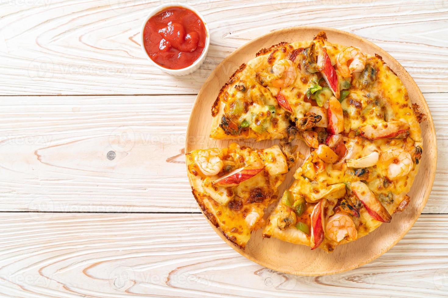 seafood pizza on wood tray photo