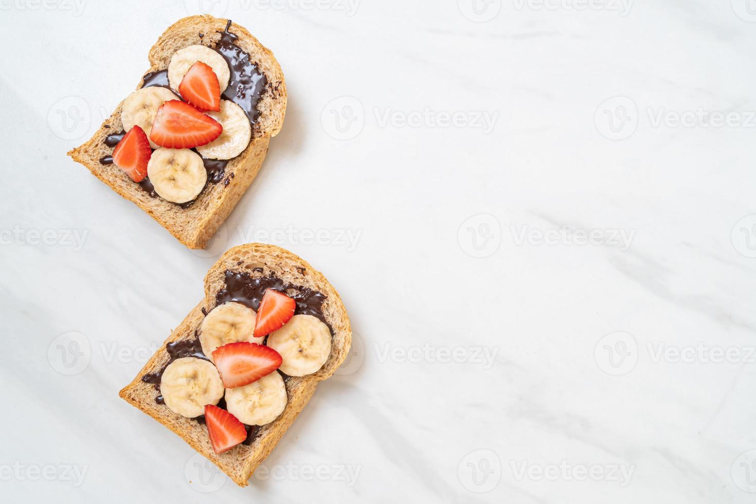 whole wheat bread with fresh banana, strawberry and chocolate photo