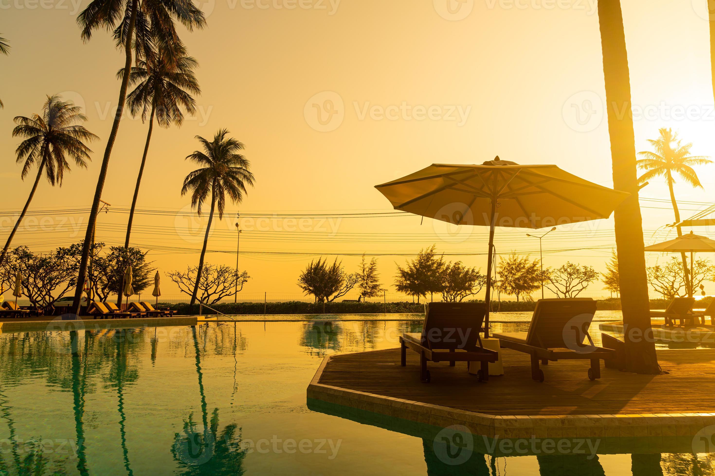 umbrella with bed pool around swimming pool with ocean sea background