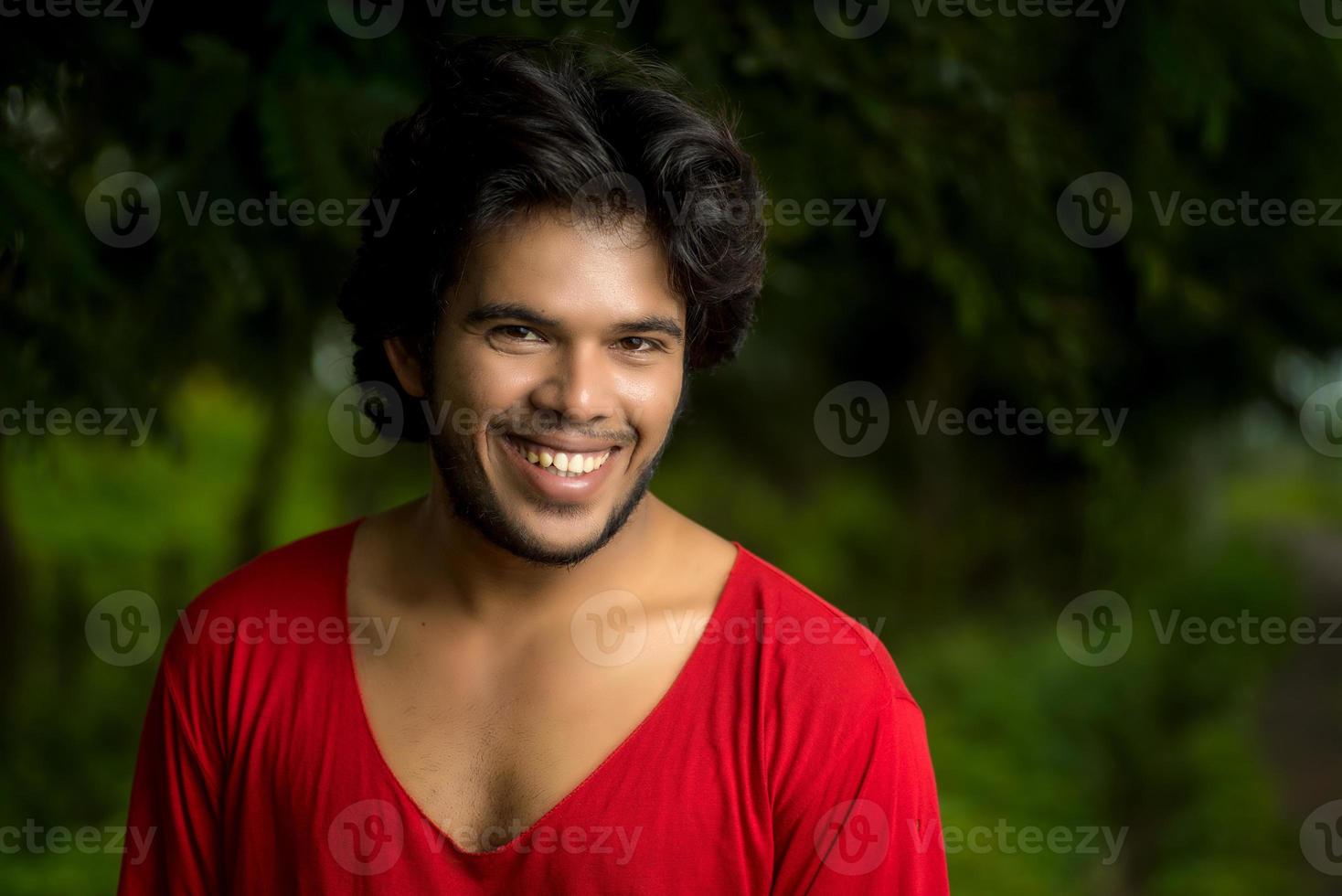 Handsome fashion young man posing outdoors photo