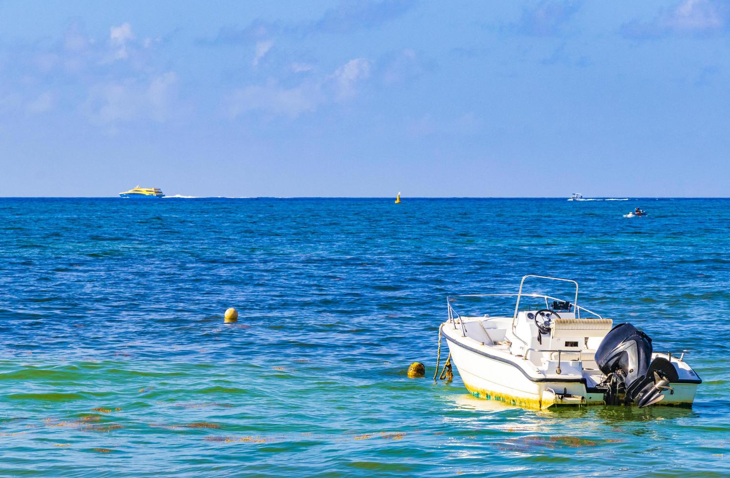 Boats yachts at Tropical mexican beach Playa del Carmen Mexico. photo