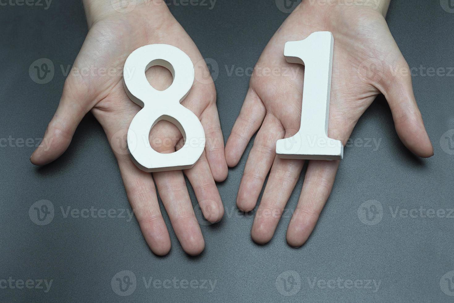 To female hands the figure of eighty-one. photo