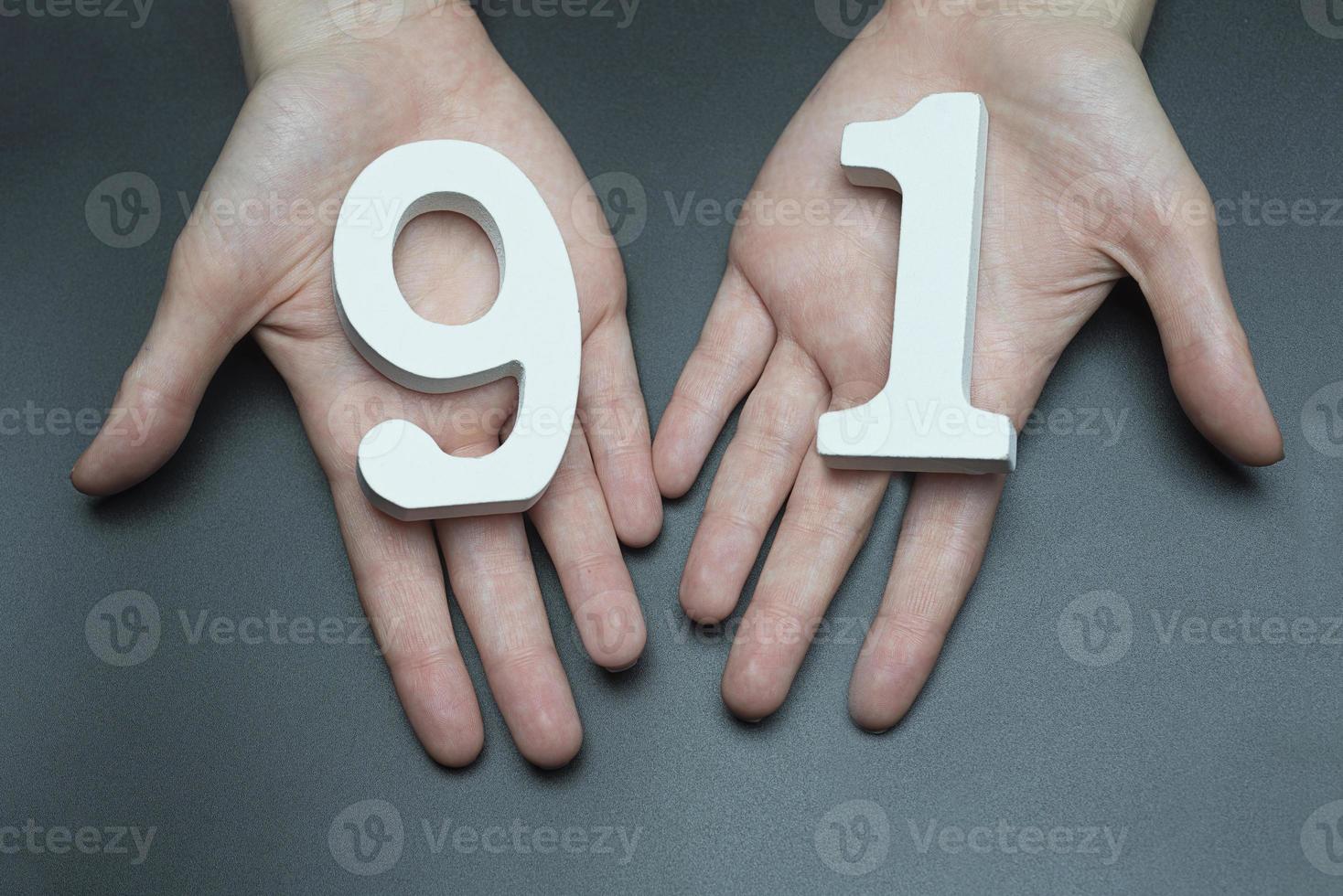 To female hands the figure of ninety-one. photo