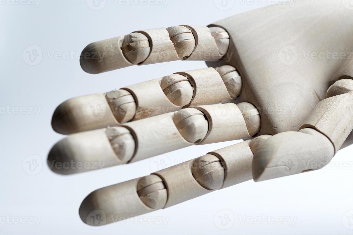 Wooden hand on a white background. photo