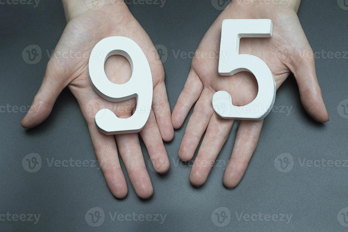 To female hands the figure of ninety-five. photo