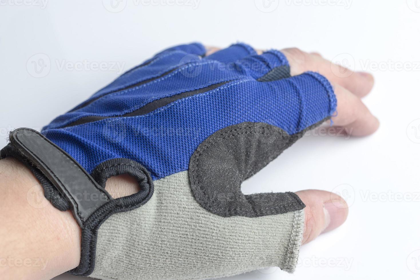 Hand in a sports glove on a white background. photo