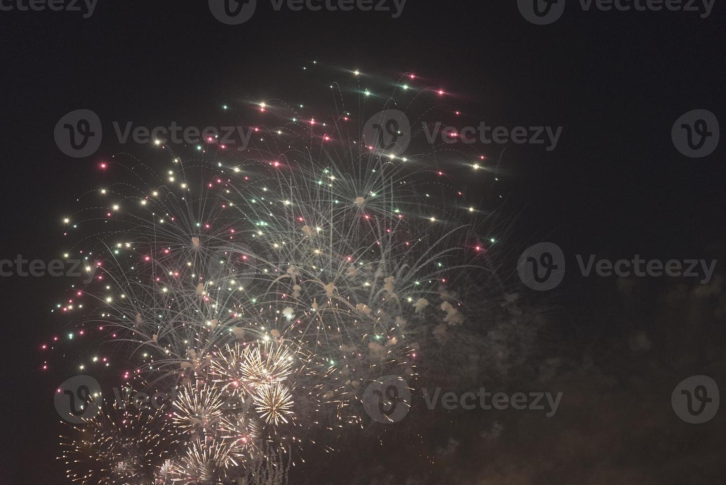 Fireworks in the night sky on a holiday. photo