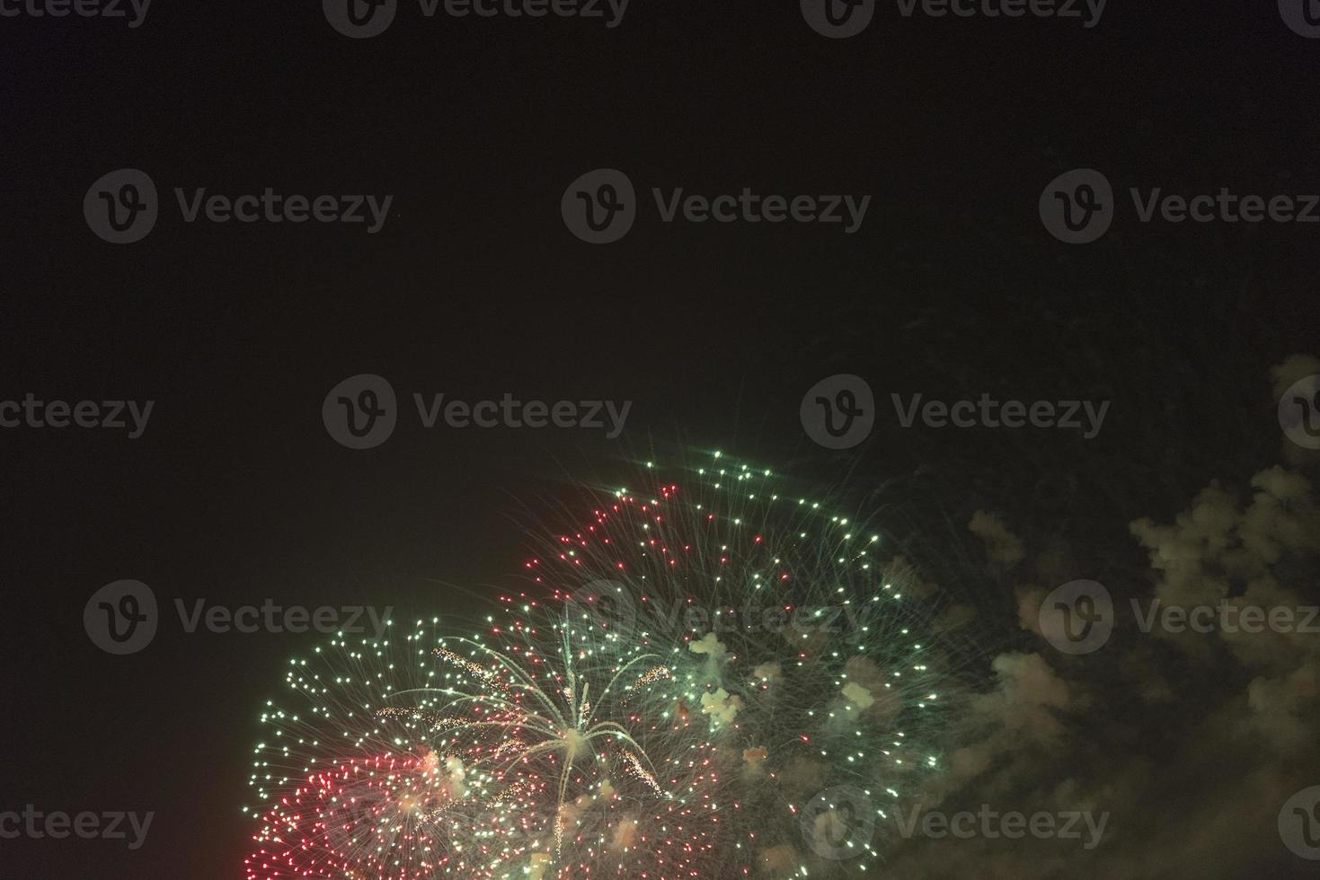 Fireworks in the night sky on a holiday. photo