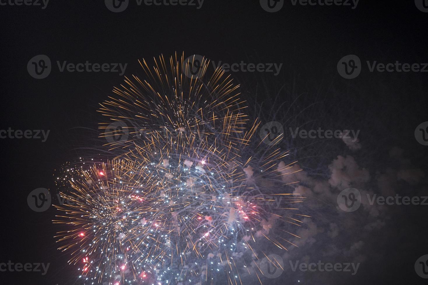 Fireworks in the night sky on a holiday. photo