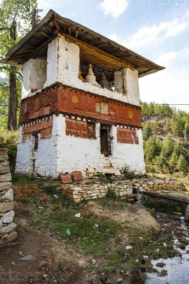 Tower with pagodas and chorten next to the ruins of the Drukgyel Dzong monastery in Paro, Western Bhutan, Asia photo