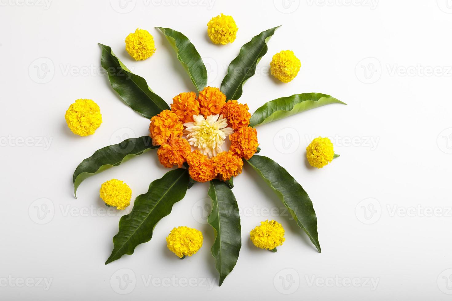 Marigold Flower rangoli Design with green leaf for traditional Festival. photo