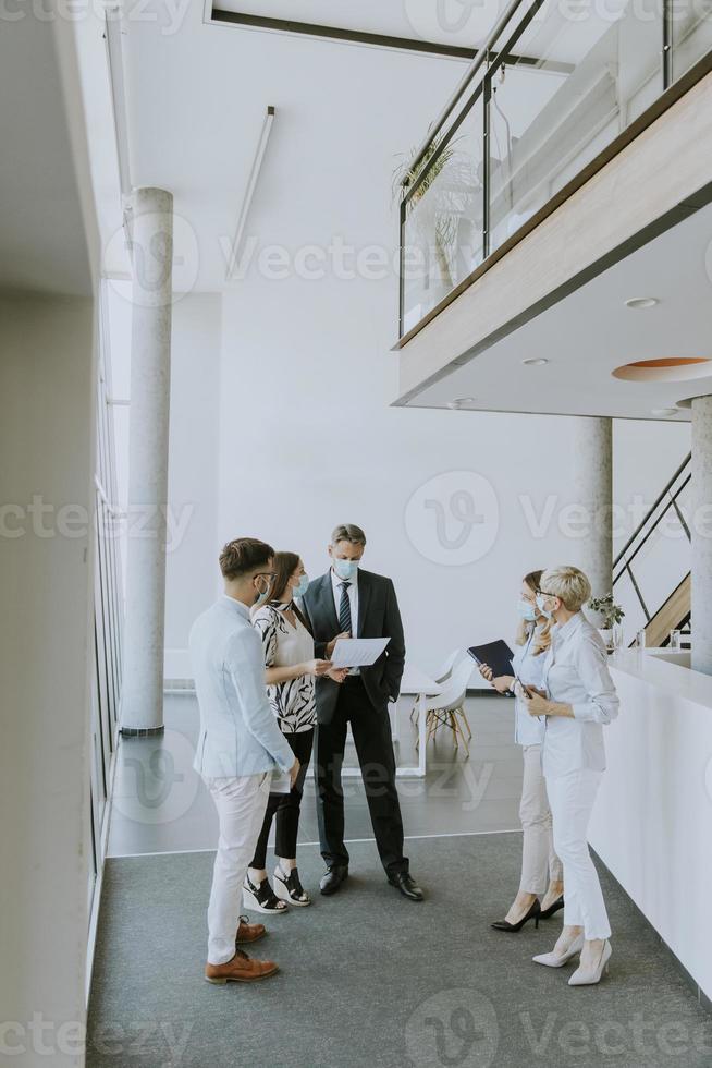 View at group of business people working together and preparing new project on a meeting in office photo
