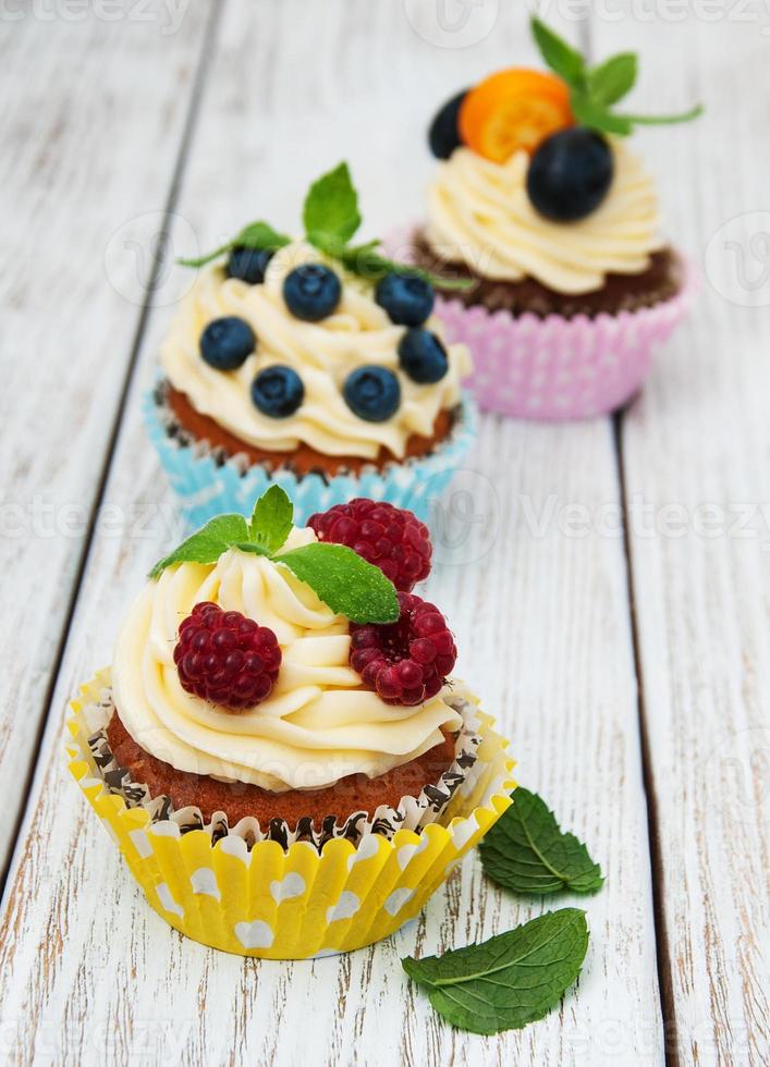 Cupcakes with fresh berries photo