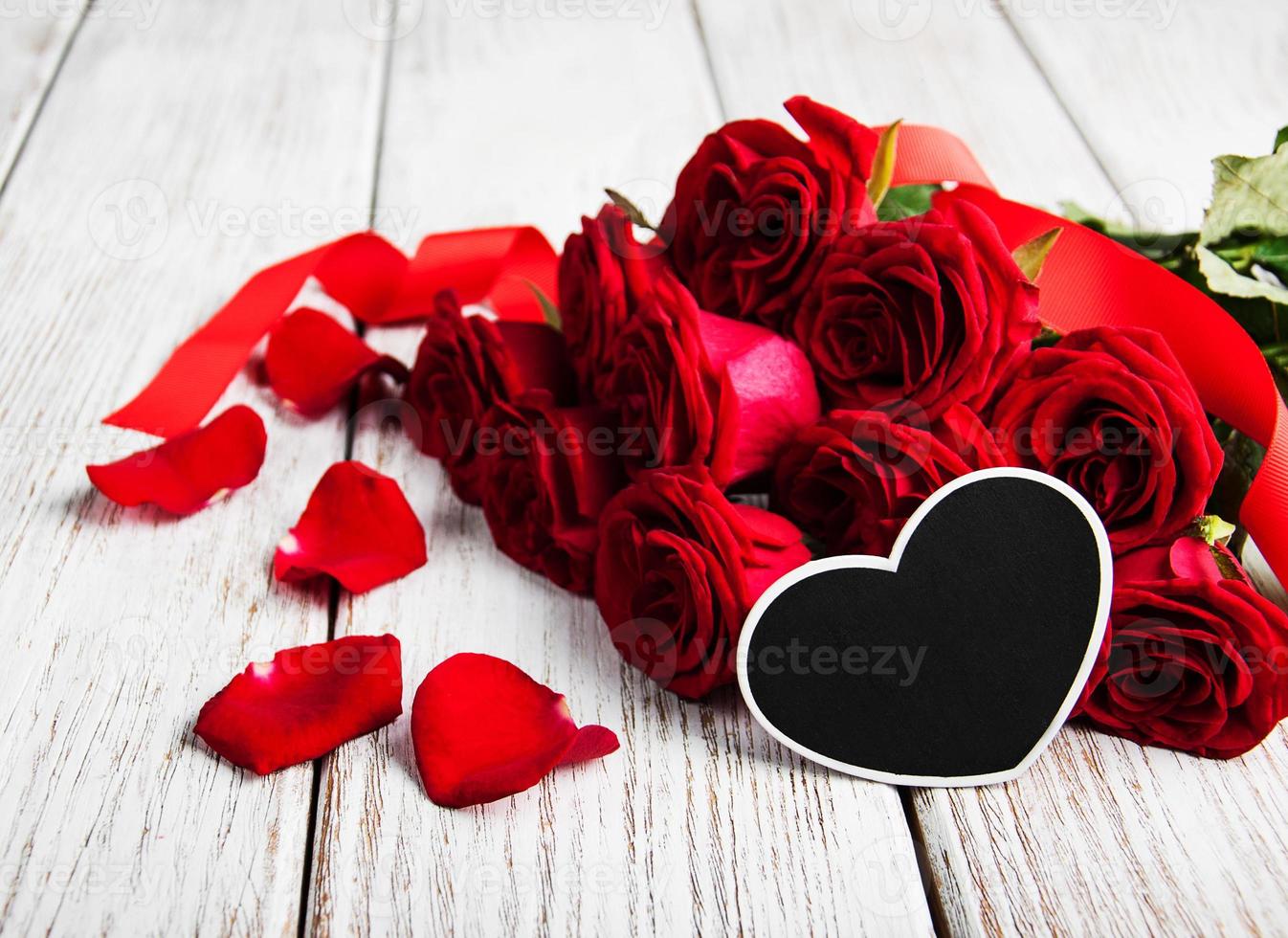 Red roses on a table photo