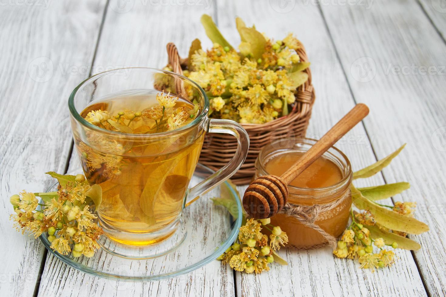 cup of herbal tea with linden flowers photo