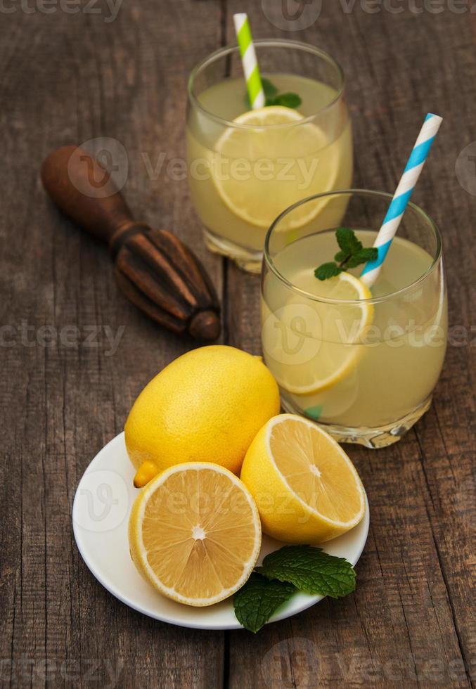 Glasses of lemon juice photo