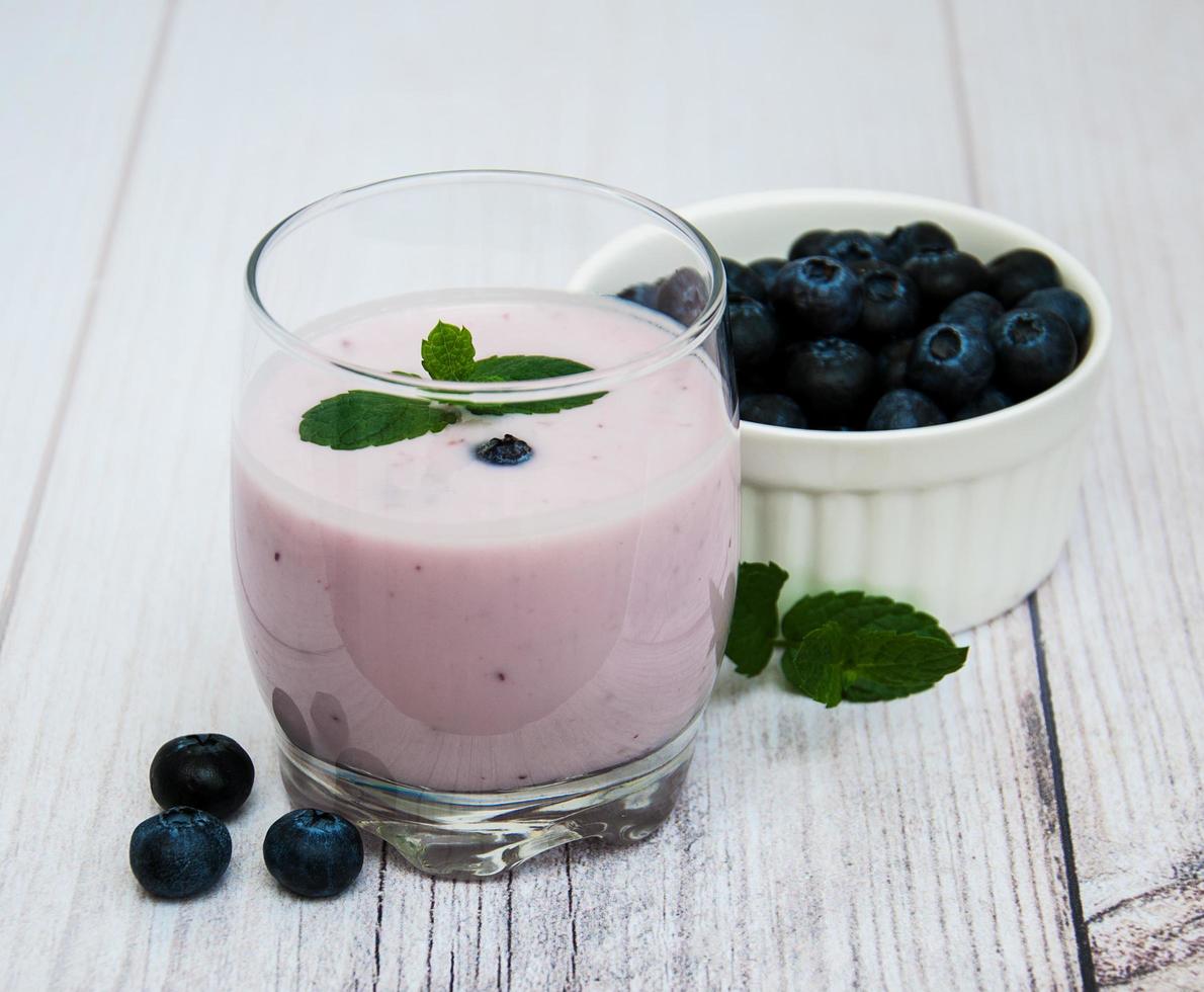 Glass with blueberry yogurt photo