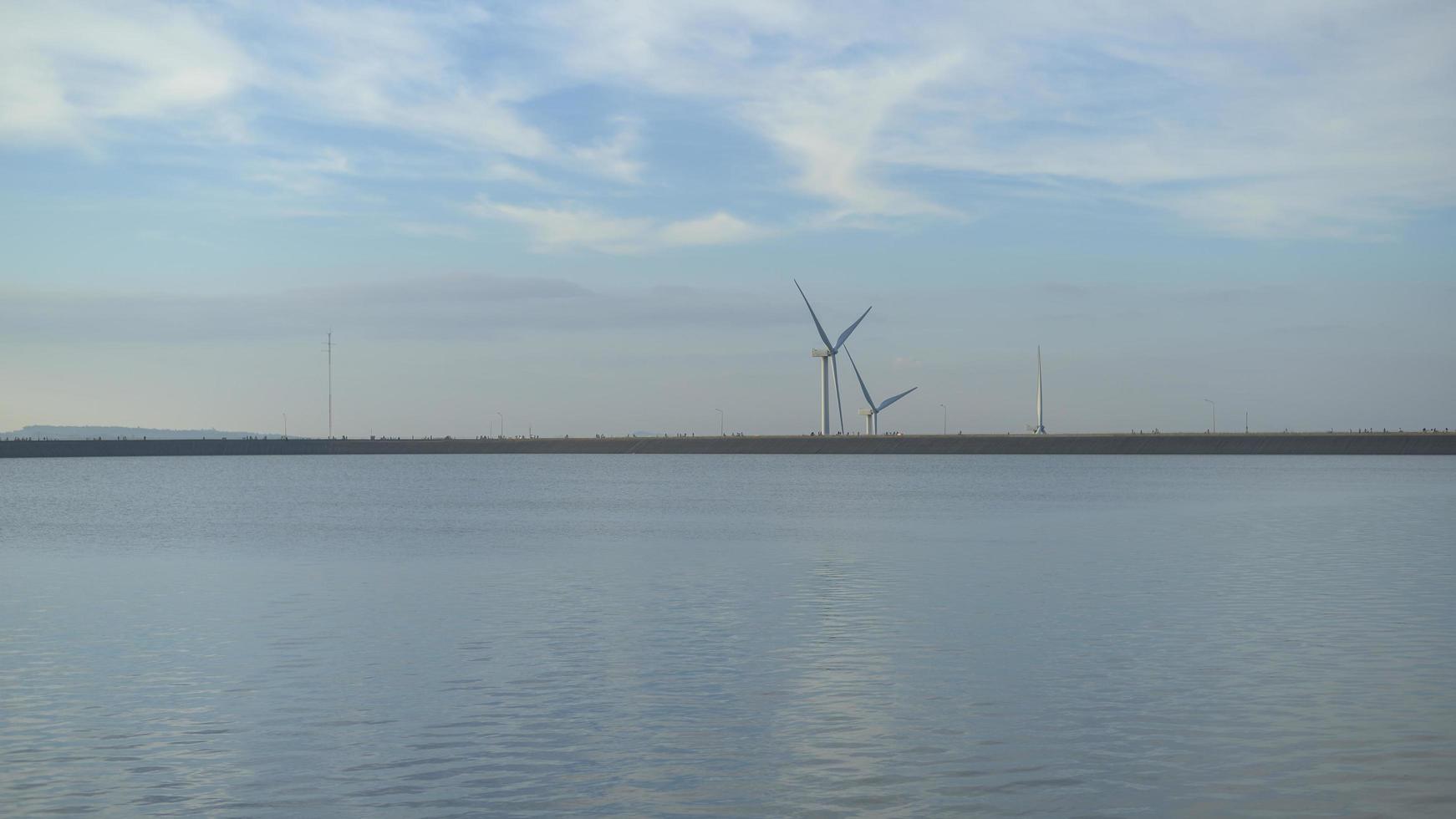 a background of wind turbines  at sunset. photo