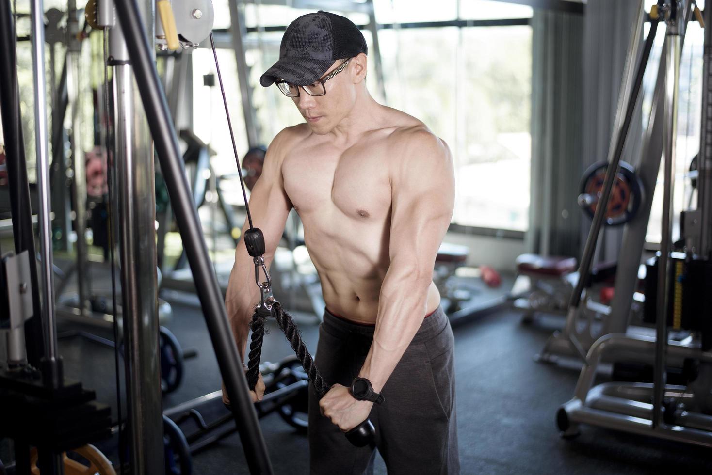 A fitness man work out in the gym photo