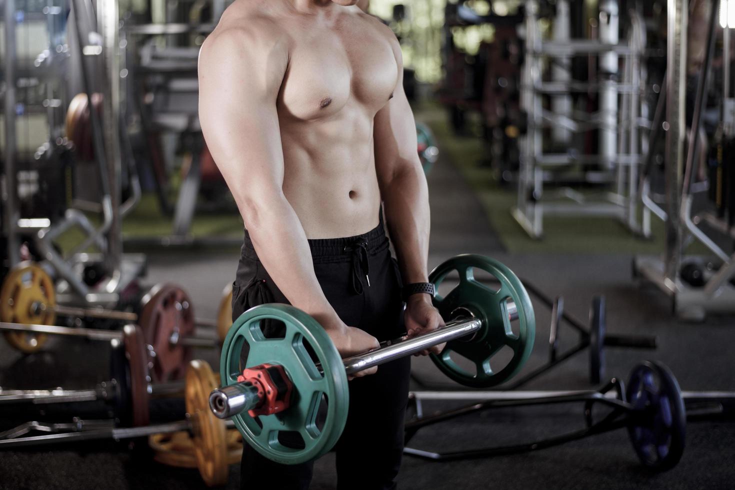 A fitness man work out in the gym photo