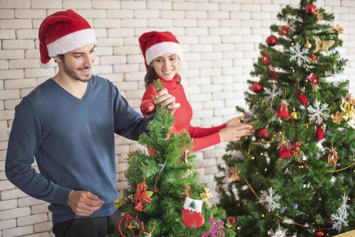 Attractive Caucasian couple of love are  celebrating Christmas in home photo