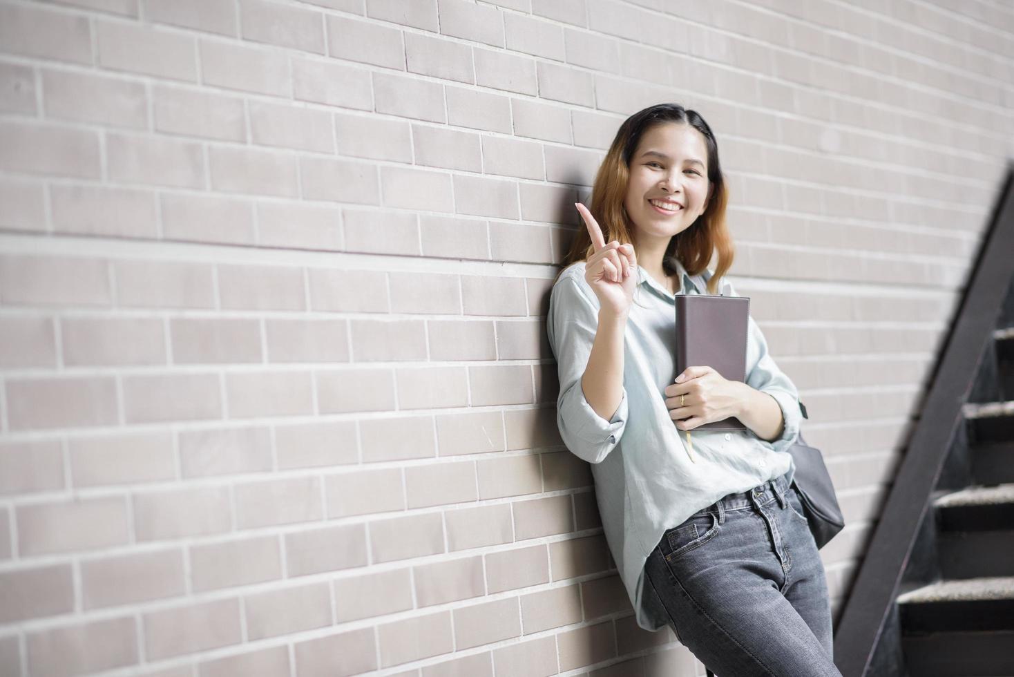 Happy young Asian University student. photo