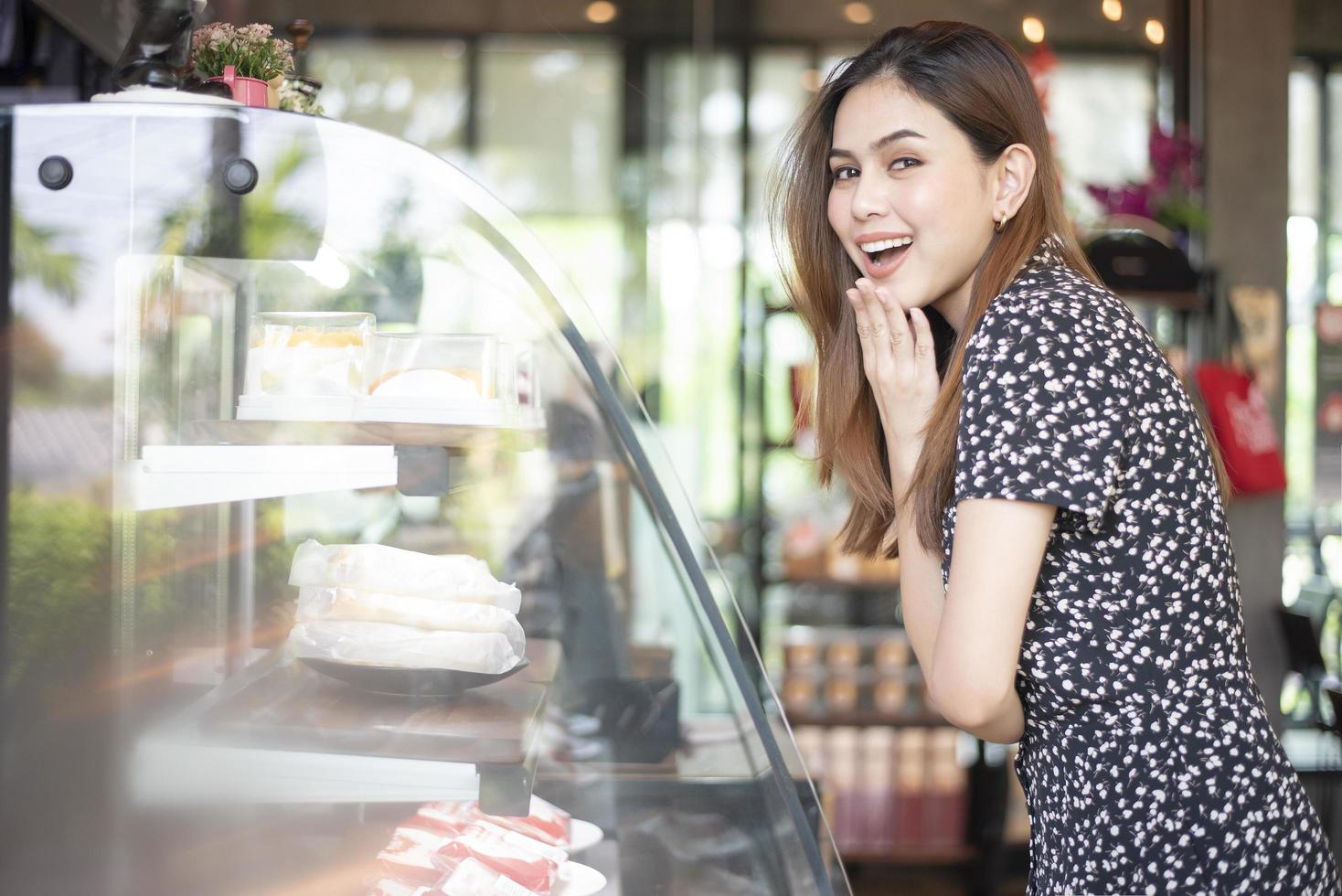 Beautiful woman in bakery shop photo