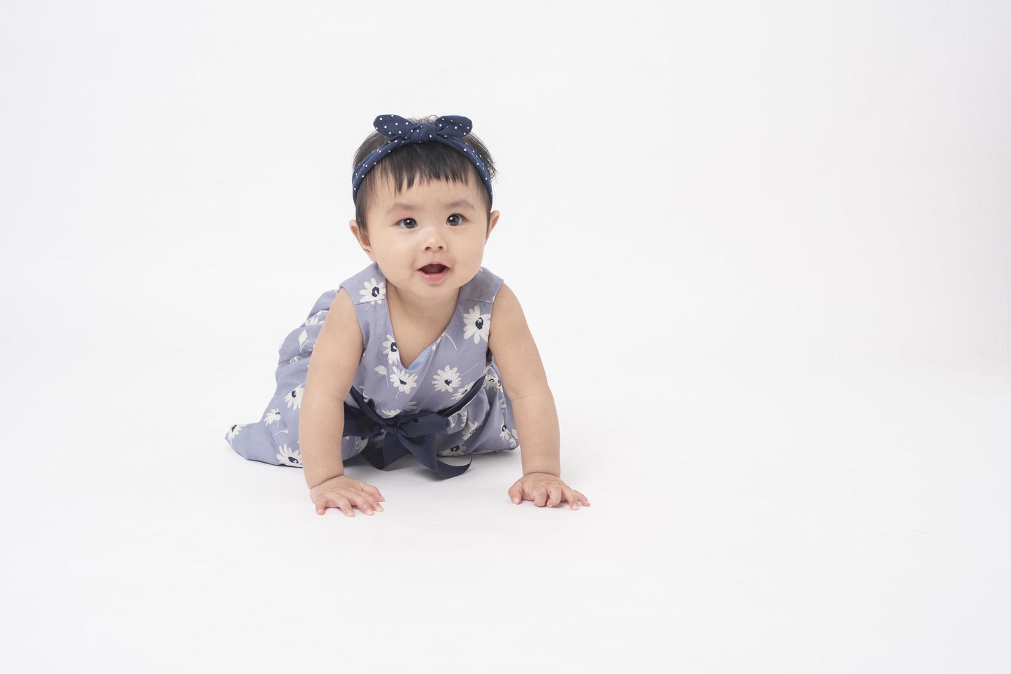 Adorable Asian baby girl is portrait on white background photo