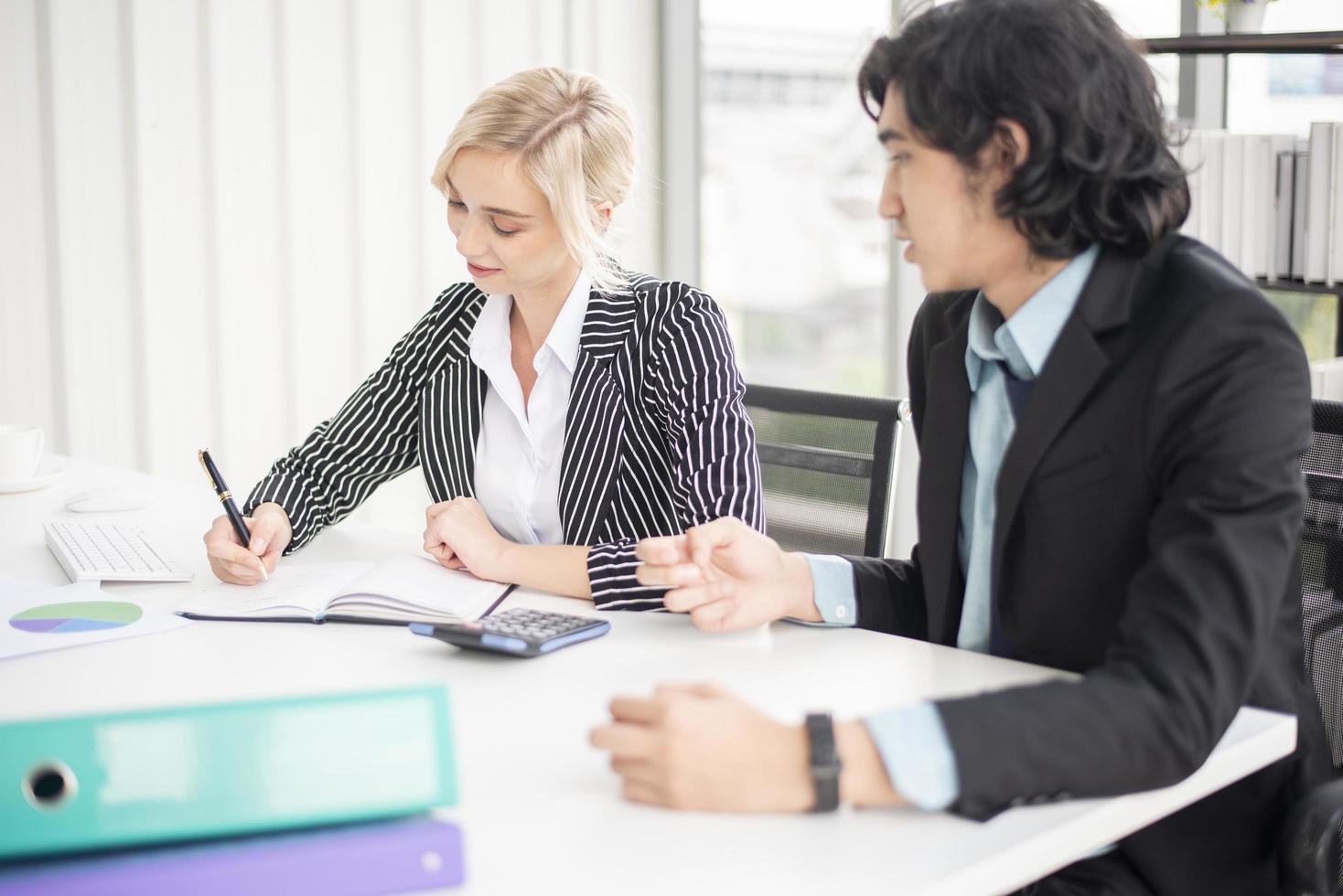 Business people are analyzing financial report photo