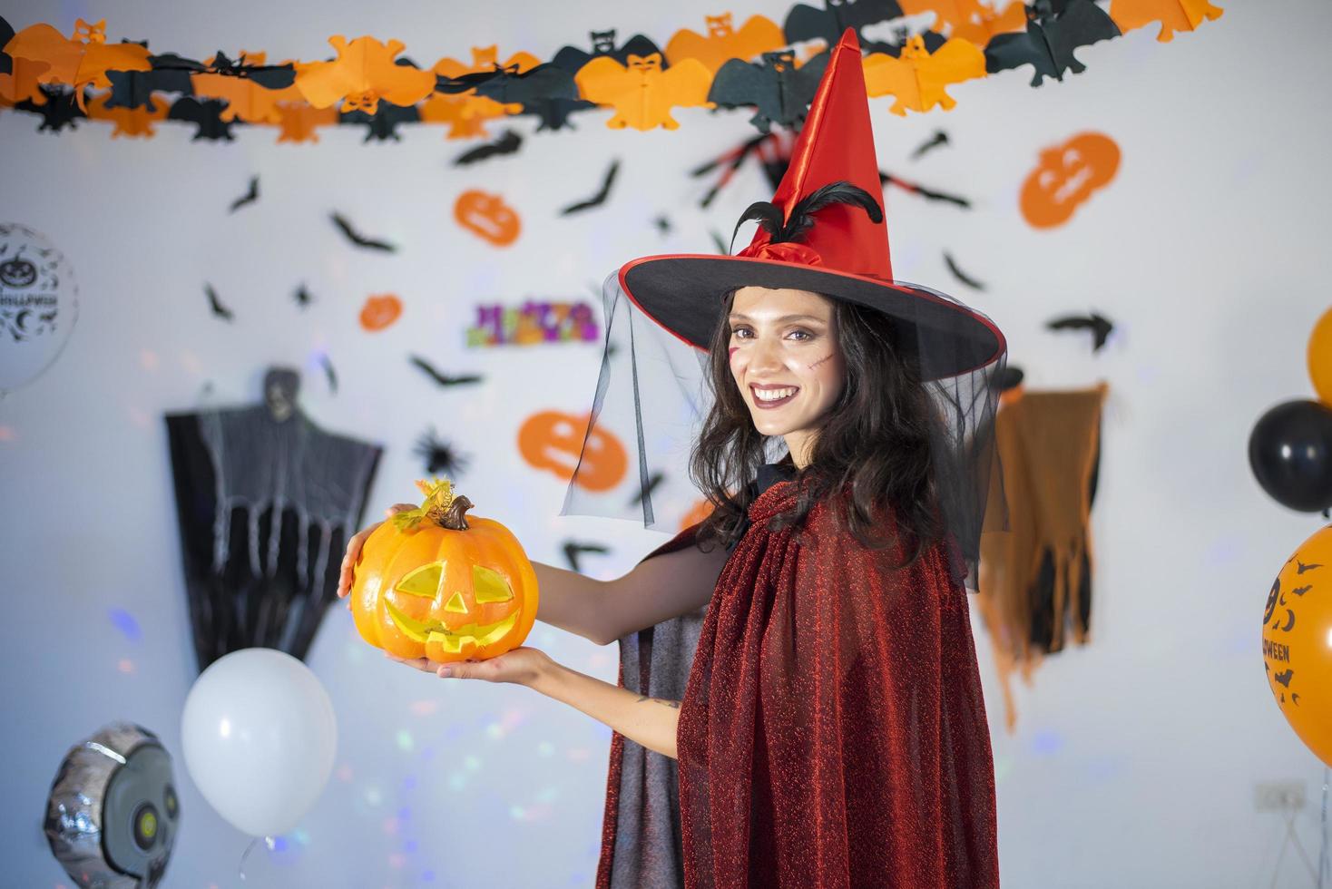 happy couple of love  in costumes and makeup on a celebration of Halloween photo