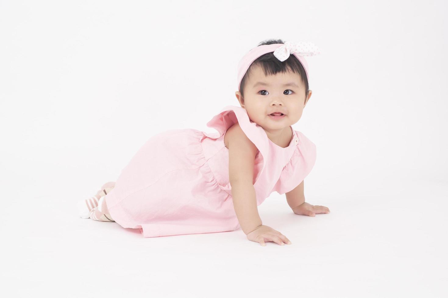 Adorable Asian baby girl is portrait on white background photo